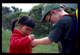 Caleb shows Maggie a bug