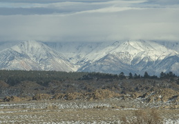 clouds hovering across the mountains