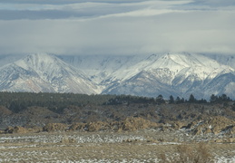 clouds hovering across the mountains