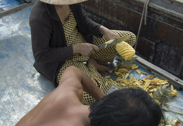 slicing up pineapple